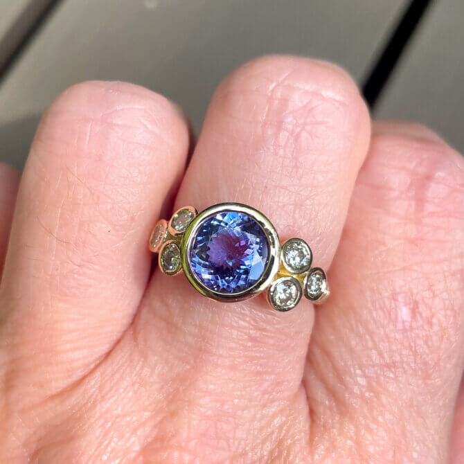 A treasured tanzanite restored to its original brilliance and set in a contemporary custom-designed ring.