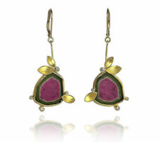 Client had a watermelon Tourmaline necklace and wanted to create complimentary earrings. Liaung Chung Yen created this earring design for us in 18K gold w/diamonds.