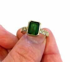 Client's wanted a new setting for a cherished tourmaline. The tourmaline had signs of wear so we recut it slightly and polished it to bring it to life. We created a hammered band completed the look she wanted.