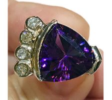 This stunning amethyst trillion was purchased at our Gemstone Roundtable and set in 14k gold with diamonds by Dyanne Belle.