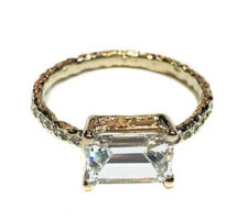 Custom designed engagement ring by Dyanne Belle with client’s baguette diamonds in 14k gold with pave diamonds.