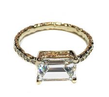 Custom designed engagement ring by Dyanne Belle with client’s baguette diamonds in 14k gold with pave diamonds.