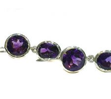 These earrings, set in sterling silver, were designed by Dyanne Belle with a client’s amethyst stones.