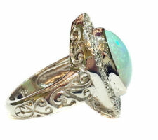 Custom engagement ring with client opal and diamonds set in 14k white gold, side view.