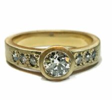 Using the client’s family diamond, Dyanne Belle created this lovely engagement in 14k yellow gold.