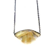 Gorgeous gold rutilated quartz from our Gemstone Roundtable made into this statement necklace in dark rhodium plated silver.