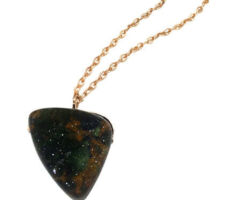 Idocrase Druzy from our Gemstone Roundtable set as a pendant on a yellow silver chain.