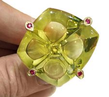 This gorgeous citrine gem was purchased at our Gemstone Roundtable and was custom cut by John Dyer. It was set in 18k yellow gold with rubies; designed by Odaybea Morrow, created by Catherine Rudacille.