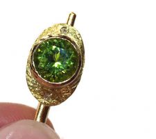 Gorgeous peridot stone purchased at our Gemstone Roundtable and set in 18k yellow gold with diamonds by Liaung Chung Yen.