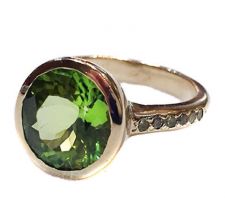 The peridot in this ring was purchased at our Gemstone Roundtable and was set in 14k gold with pave peridot down the shank by Dyanne Belle.