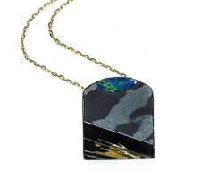 Purchased from our Gemstone Roundtable, this Steve Walters composite of opal, rutilated quartz and onyx was set in rhodium plated silver by Dyanne Belle.