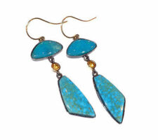 The Kingman turquoise was purchased at our Gemstone Roundtable. The stones are set in rhodium plated silver by Dyanne Belle.