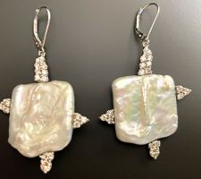 Pearl purchased at our Gemstone Roundtable. Client wanted to use her diamonds to create this design in 14K White Gold.