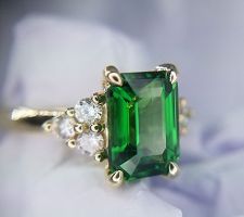 We found this gorgeous 2.3 carat tsavorite garnet for our clients who wanted this center stone. We then brought their design ideas to life .