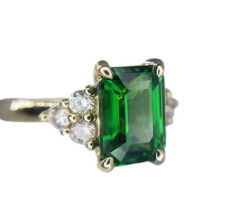 We found this gorgeous 2.3 carat tsavorite garnet for our clients who wanted this center stone. We then brought their design ideas to life .