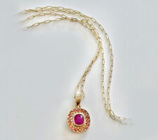 Purchased sapphire at our Gemstone Roundtable. Pink Sapphire is surrounded by a halo of orange sapphires and set in 14K yellow gold.