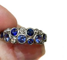 Using diamonds and sapphires from the rings in the previous photo, Dyanne Belle created this modern ring in 14k white gold.