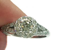 Dyanne Belle designed this lovely engagement ring using 14k white gold and additional diamonds for the pave work.