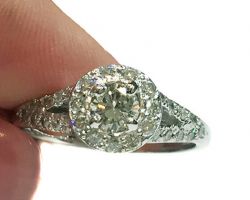 Dyanne Belle designed this lovely engagement ring using 14k white gold and additional diamonds for the pave work.