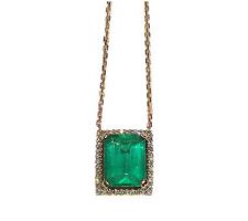 Originally a ring, this emerald and diamond necklace was created by Dyanne Belle for one of our clients.