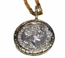 Dyanne Belle designed this pendant with a client’s ancient Greek coin. The coin is set in 14k yellow gold.