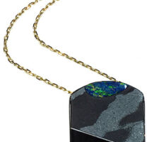 Purchased from our Gemstone Roundtable, this Steve Walters composite of opal, rutilated quartz and onyx was set in rhodium plated silver by Dyanne Belle.
