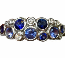 Using diamonds and sapphires from the rings in the previous photo, Dyanne Belle created this modern ring in 14k white gold.